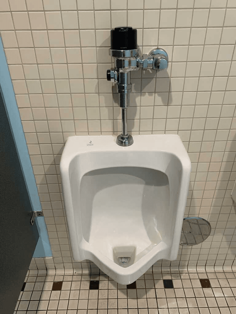 Spotless urinal after commercial restroom cleaning